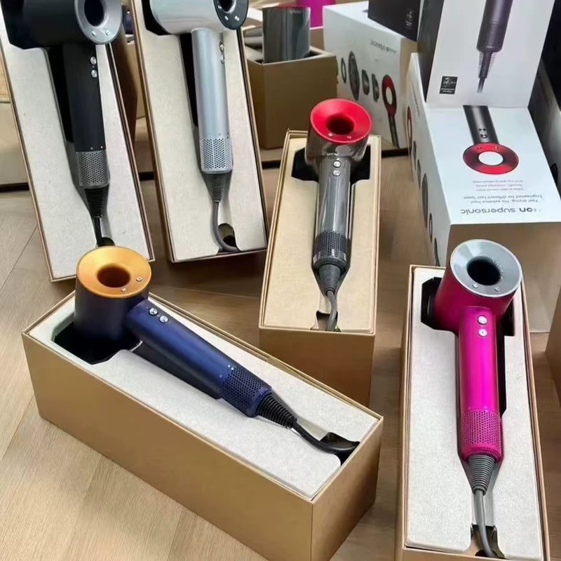Display of multiple hair styling tools including blue and pink cordless hair dryers with colored attachment heads in tan