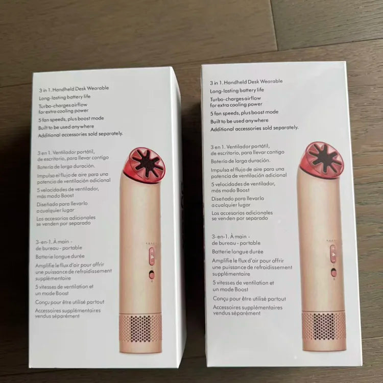 Two beige and rose-gold handheld portable fans with mesh grilles and circular vents displayed on white product boxes with