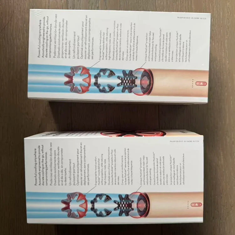 Two stacked product boxes with beige cylindrical hair styling tool showing internal red and black fan-like attachments
