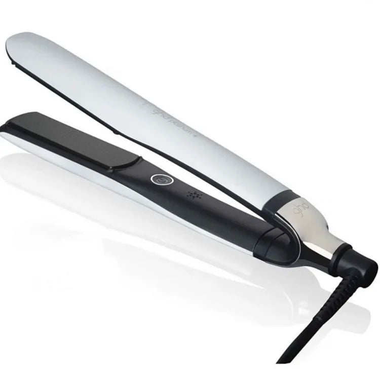 Two professional hair styling tools - a white ceramic hair straightener and a black ionic hair dryer with cord, displayed at