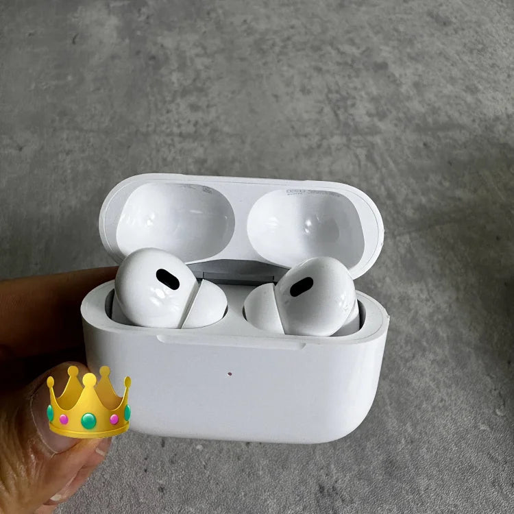 White wireless earbuds with charging case open, displaying two earbuds inside and two in the case lid, held in hand against